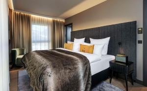 King One Bedroom Suite with Alpine View room in Grand Tirolia Hotel Kitzbühel Curio Collection by Hilton
