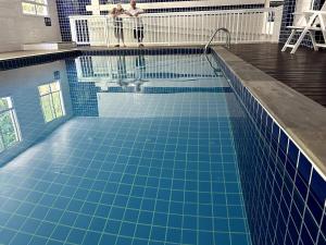 Bertioga, clube completo com piscina aquecida