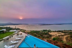 SaffronStays Sol Mere - 4BR pet-friendly pool villa with infinity pool, gazebo bar, games & massage zone, perfect for celebrations