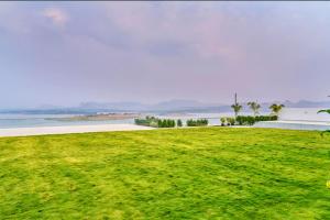 SaffronStays Sol Mere - 4BR pet-friendly pool villa with infinity pool, gazebo bar, games & massage zone, perfect for celebrations