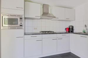 Huis Specht is perfect voor vakantie nabij meer en tuin op zuiden