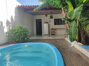 Casa com piscina e ar condicionado