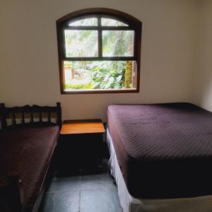 Casa com piscina e churrasqueira a 100 metros da praia