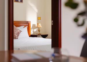 CandlePine Suites - Khách sạn căn hộ