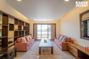 StayVista at Villa Tesoro with Outdoor Pool, WiFi