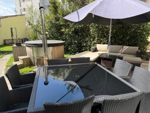Sejours chez l'habitant Du calme en pleine ville Jacuzzi : photos des chambres