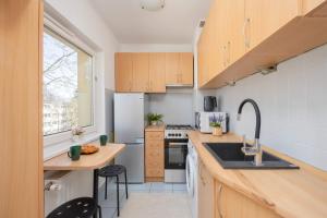 Bright Apartment in Warsaws Wola Next to the Metro by Noclegi Renters