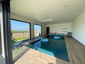 Appartements Magnifique maison vue mer avec piscine interieure : photos des chambres