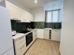 Appartements Studio neuf 50m2 dans le centre : photos des chambres