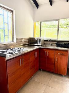 House near Marial stone and old Peñol replica