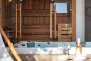 Appartements Appartement de Charme avec jacuzzi et sauna – Une Experience Authentique et Intemporelle : photos des chambres