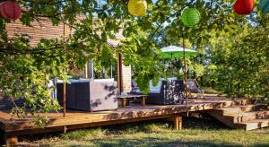 Maisons de vacances L'Ecrin de Bois - Maison d'architecte avec Spa sur un grand terrain arbore : photos des chambres