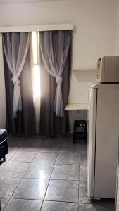 Kitnet WIFI na Praia Grande - Pleno centro da Ocian