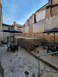 Appartements Casa Bella - Clim, Exterieur, Jeux arcade : photos des chambres
