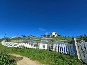 Inn the Mountain a farm house on a foggy farm hill