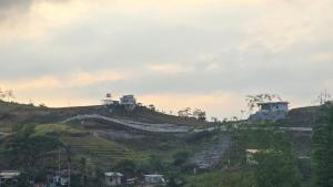 Inn the Mountain a farm house on a foggy farm hill