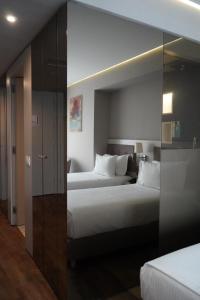 Twin Room with Sea View room in Bougainville Bay Hotel