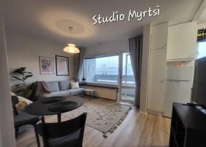 Direct train to Helsinki and airport, near shopping center