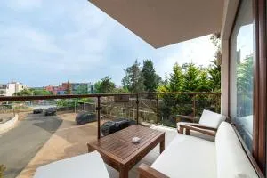 Апартаменти с чадъри и шезлонги на плажа - Дюни