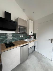 Appartements Oasis Balcon Vibes Tropicales Arena Parc Expo Clim : photos des chambres