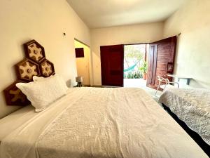 Casa Ingapura Garden Suite - Povoado Bar da Hora - 15 minutos de canoa para Atins - Estilo B&B - Café da Manhã Simples - Conforto