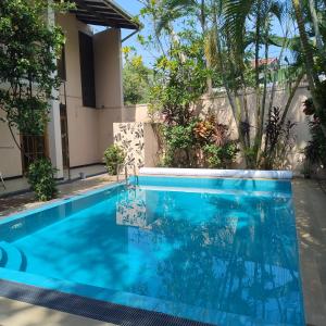 A tropical paradise; stunning house, pool, garden