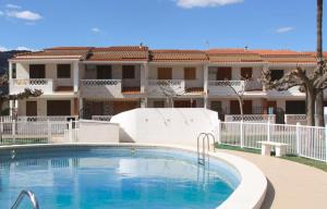 House with swimming pool next to the beach
