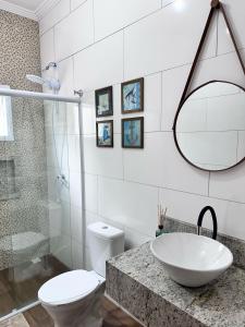 A Casa de Praia com ar, piscina aquecida e churrasqueira