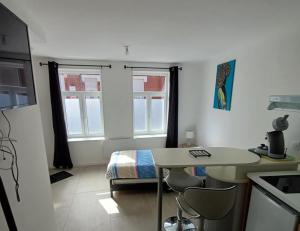 Appart'hotels Trois Studios-Cosy centre village : photos des chambres