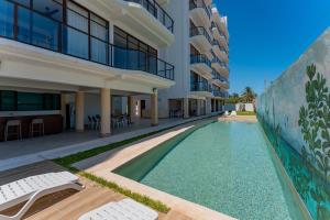 Condo vista al mar, alberca rooftop Chixchulub
