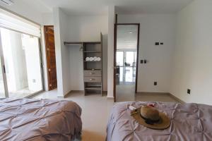 Angelina 28 Beachfront and Family Apartments - Modern and Relaxing Long Stays - 20 min from Cancun Airport
