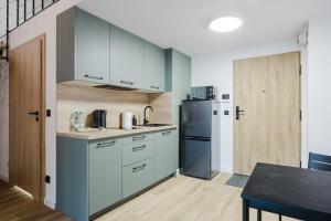 Osiedle Piastowskie Mezzanine Apartment by BookingHost