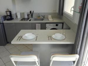 Appartements Downtown Apartment : photos des chambres