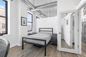 Modern Historic Loft 19ft Ceilings, Gym, Heated Parking, Skyline Views, Balcony