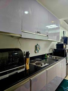 Hannahs Crib at Shore Residences with Balcony and Pool View