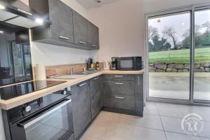 Maisons de vacances La grange du petit kernon : photos des chambres