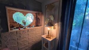 Tentes de luxe La cabane des amoureux du jardin : photos des chambres