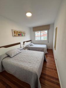 Enjoy Sanxenxo,200m Playa, Balcón Vistas Cíes, Piscina & Terraza Azotea,2 plazas Garaje, 2 Baños, Muy Luminoso, Muy Tranquilo,Muy Equipado, Céntrico