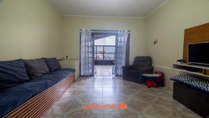 Casa na Praia Grande com Churrasqueira e Quintal