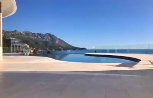 Luxe Beachfront Stay in Bečići with Pool