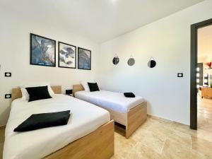 Appartements Le Jasmin 2 - Chic, Clim, Terrasse, Neuf, 3 lits, 4 personnes : photos des chambres
