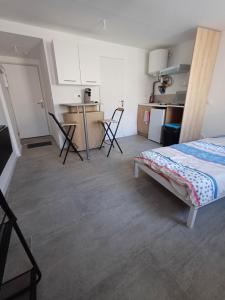 Appart'hotels Trois Studios-Cosy centre village : photos des chambres