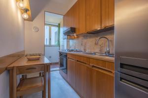 GuestHost - Maggiore Hospital & Ara Stadium Apt