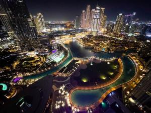 GRANDE SIGNATURE with a direct Burj Khalifa view and Private Fountain Show at high floor with DXB AIRPORT VIP Shuttle option for 6 guests