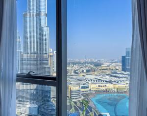 GRANDE SIGNATURE with a direct Burj Khalifa view and Private Fountain Show at high floor with DXB AIRPORT VIP Shuttle option for 6 guests