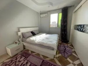 Purple Room in a sharing apartment - Beni Ghâlib
