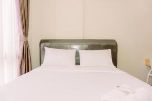 Homey and Modern Look 1BR at Asatti Apartment By Travelio