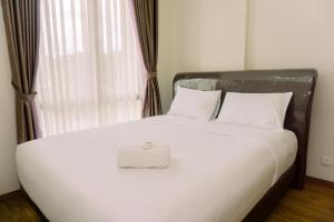 Homey and Modern Look 1BR at Asatti Apartment By Travelio