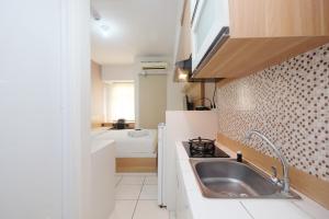 Modern Studio with Great Lake View at Springlake Summarecon Apartment By Travelio