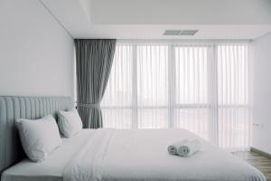 Wonderful and Homey 1BR The Smith Alam Sutera Apartment By Travelio